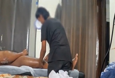 Man jerks in front of Indian masseuse during a massage